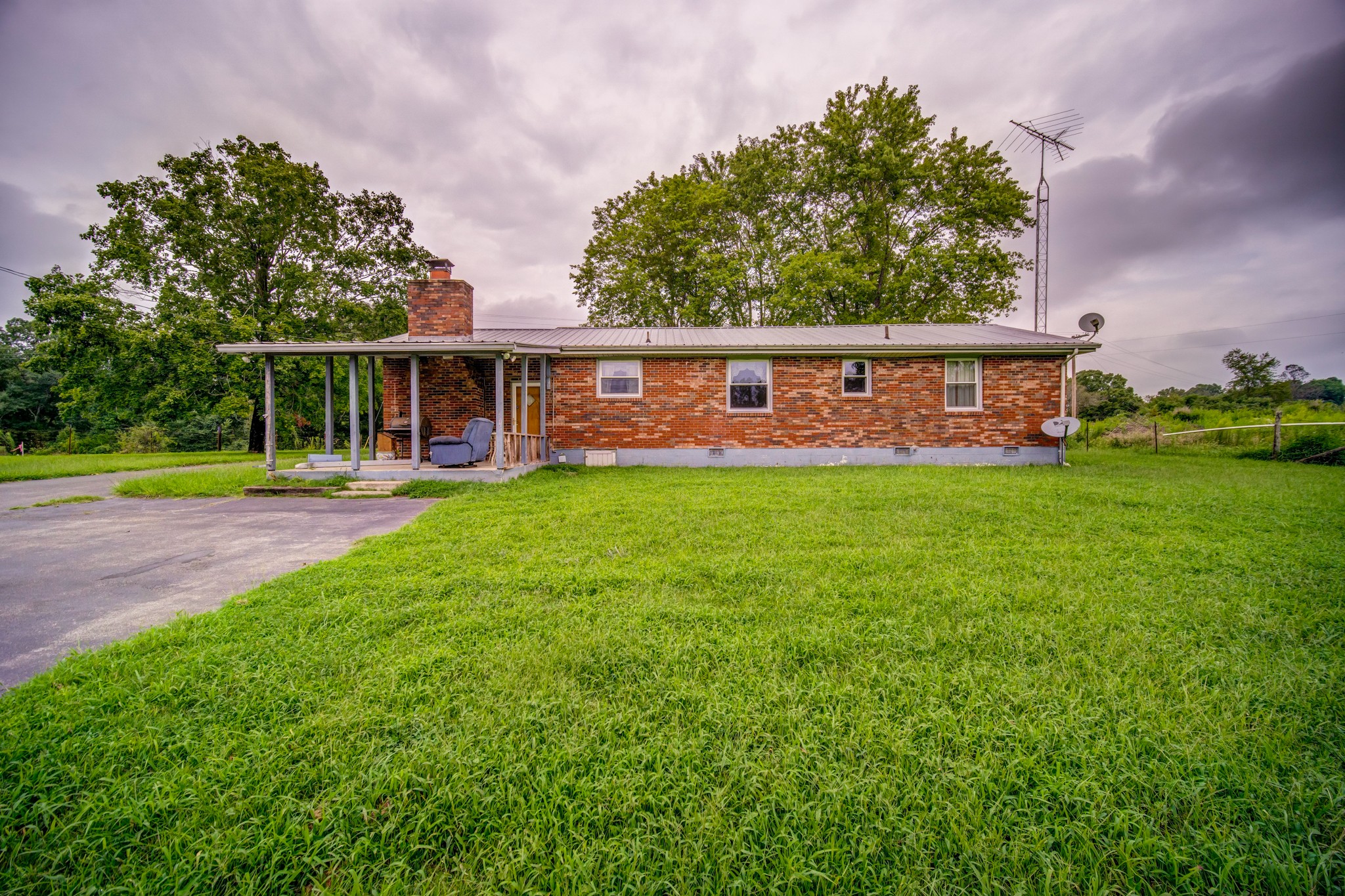 1377 Deal Road Burns, TN 37029 - Photo 41 of 47 a view of a house with a yard and sitting area