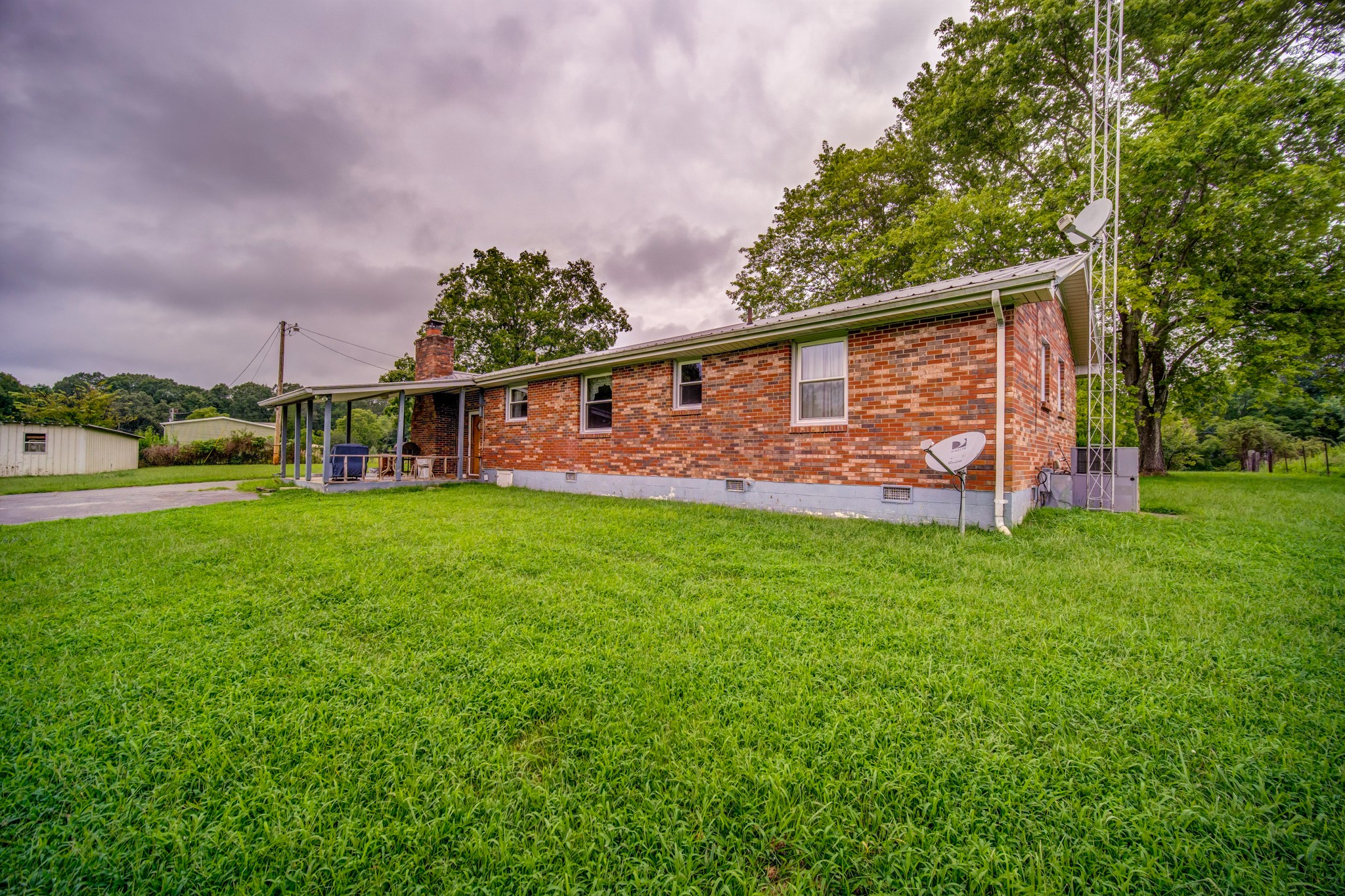 1377 Deal Road Burns, TN 37029 - Photo 43 of 47 a front view of house with yard and green space