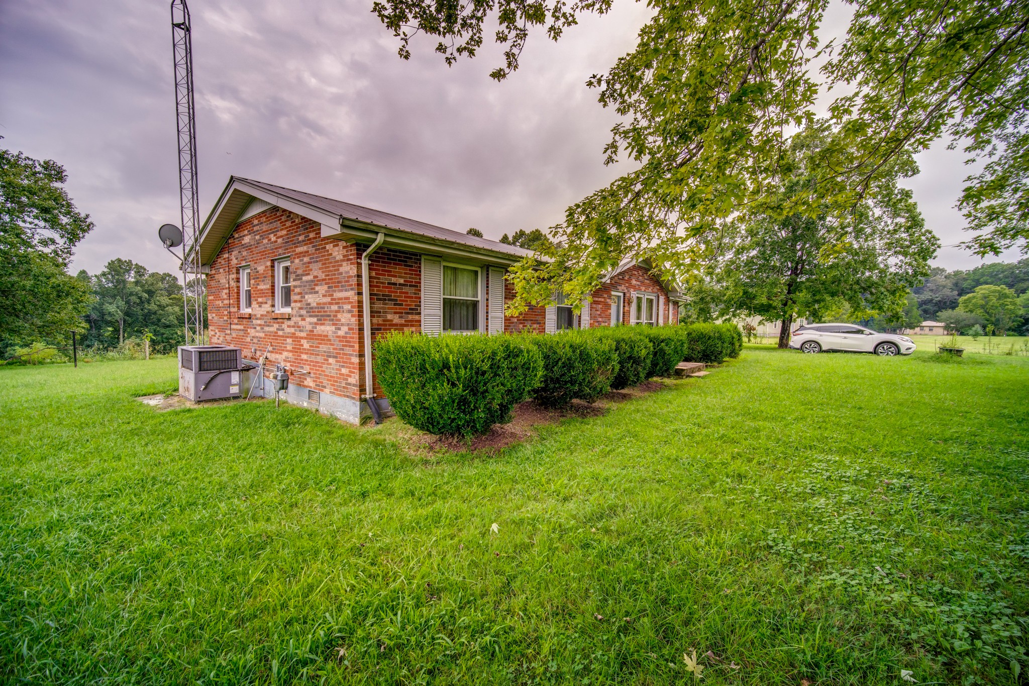 1377 Deal Road Burns, TN 37029 - Photo 5 of 47 a front view of house with yard and green space