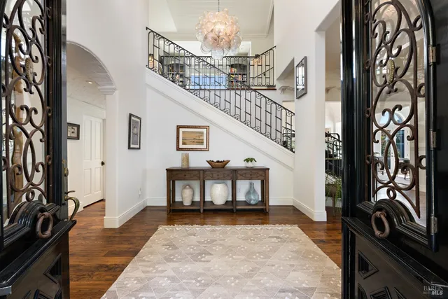 a living room with fireplace furniture and a wooden floor
