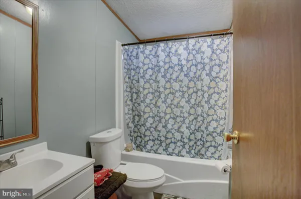 a bedroom with a bed and dresser