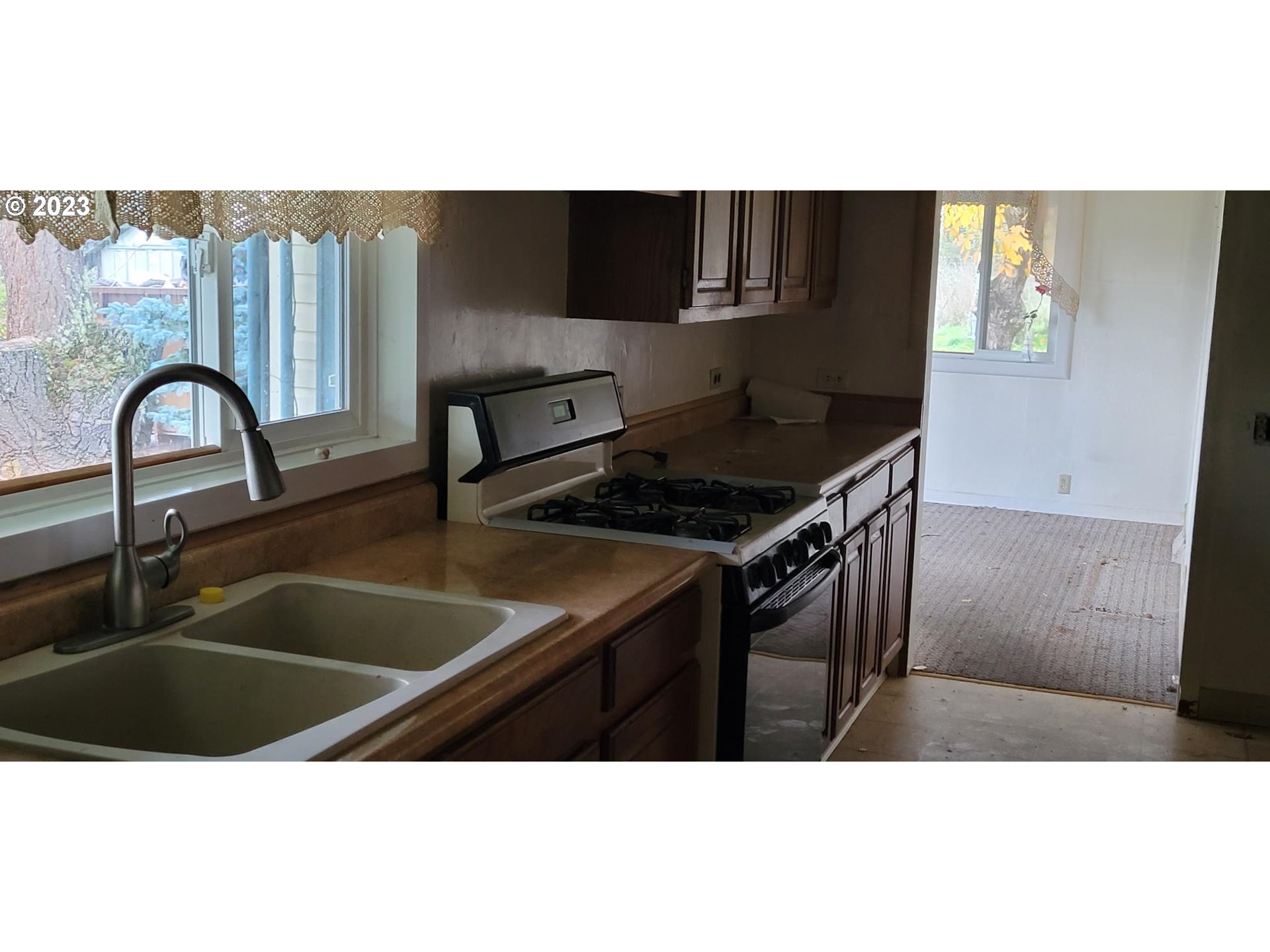 362 Northside Road Sutherlin, OR 97479 - Photo 2 of 4 a kitchen with a sink a counter and cabinets
