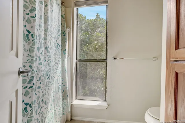 a bathroom with a shower curtain
