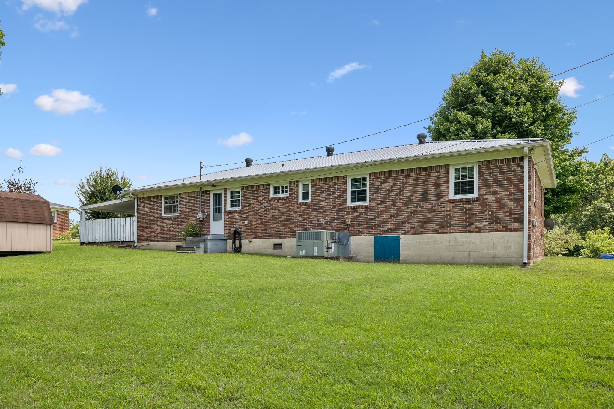 708 Hickory Street Centerville, TN 37033 - Photo 36 of 57 a view of a house with a yard and sitting area