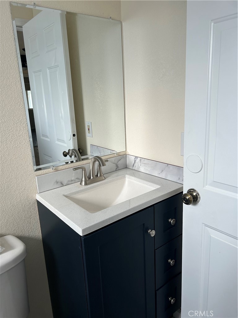 632 North Birch Avenue, Unit B Rialto, CA 92376 - Photo 7 of 8 a bathroom with a sink and a toilet