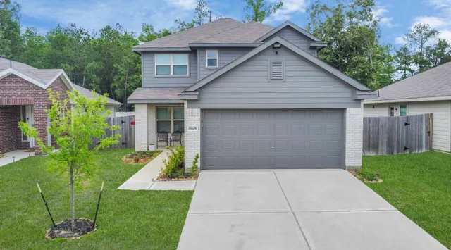 an aerial view of residential houses with outdoor space and swimming pool