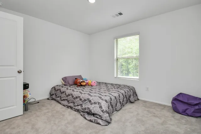 a view of yard with green space and wooden fence