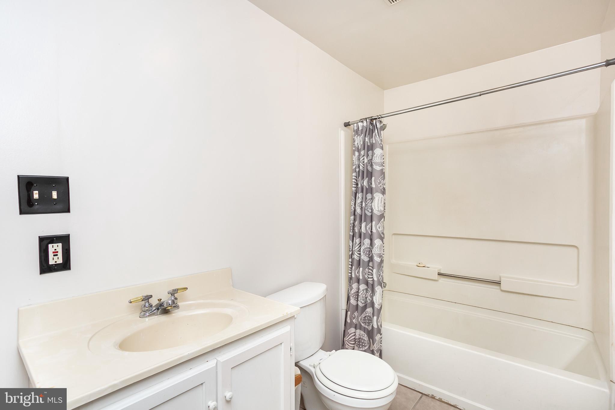 615 Nollmeyer Road Baltimore, MD 21220 - Photo 30 of 46 a bathroom with a sink toilet and shower