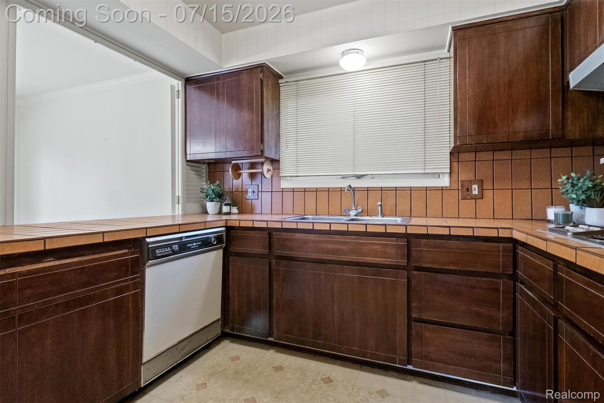 1151 Peveril Road Bloomfield Hills, MI 48304 - Photo 15 of 39 Kitchen with tray ceiling, large window above the sink and ample cabinet space