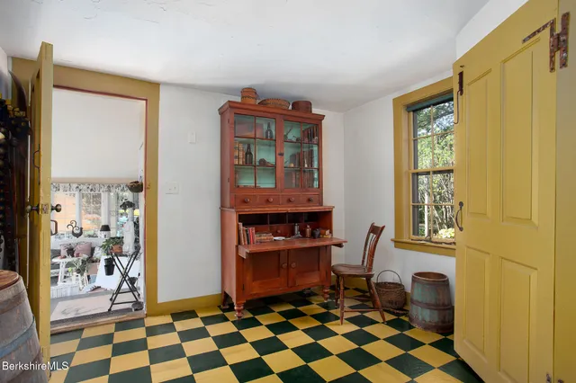 a front view of a house with a yard garage and outdoor seating