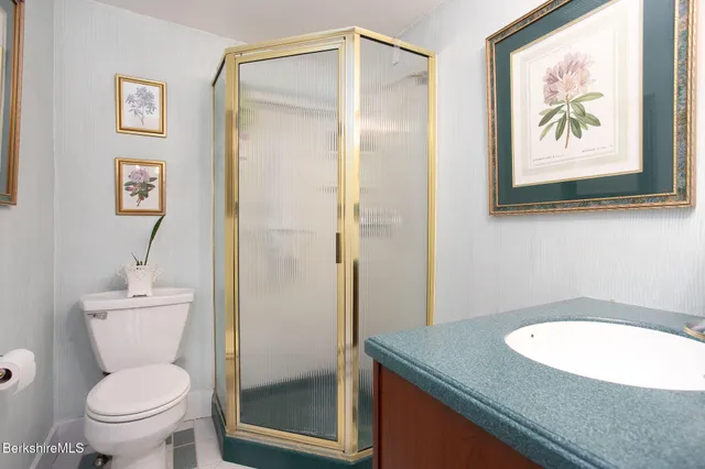 a view of a house with a deck and a yard