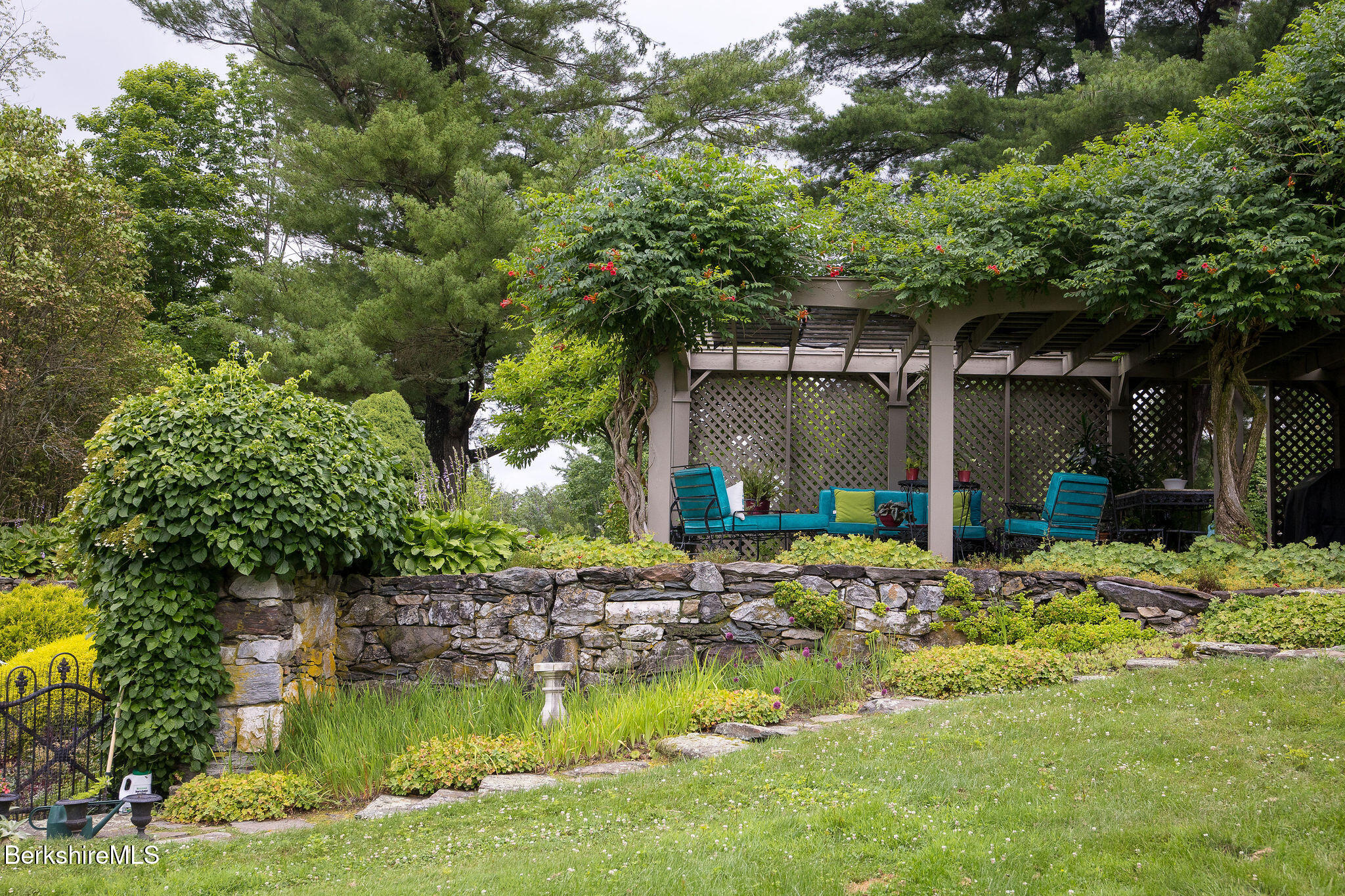 18 Goodrich Street Stockbridge, MA 01262 - Photo 42 of 63 a front view of a house with a yard garage and outdoor seating