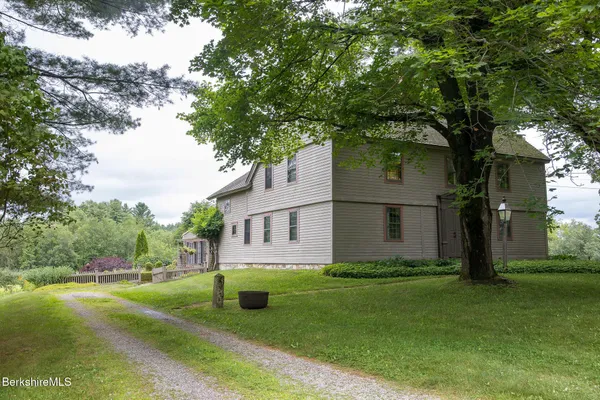 a kitchen with stainless steel appliances granite countertop a refrigerator stove and sink