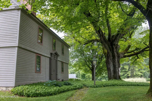 a kitchen with stainless steel appliances granite countertop a refrigerator stove and sink