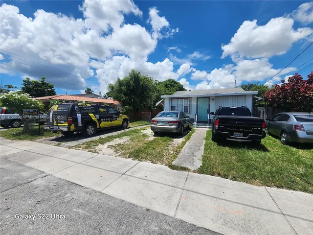 a car parked in front of a house