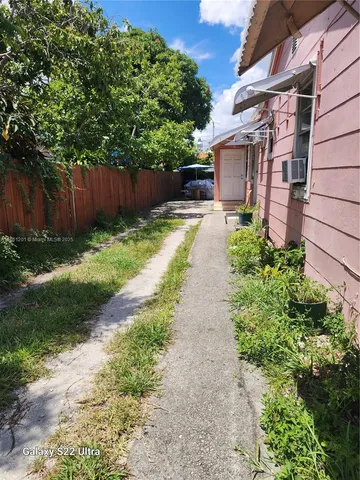 a view of a back yard with green space