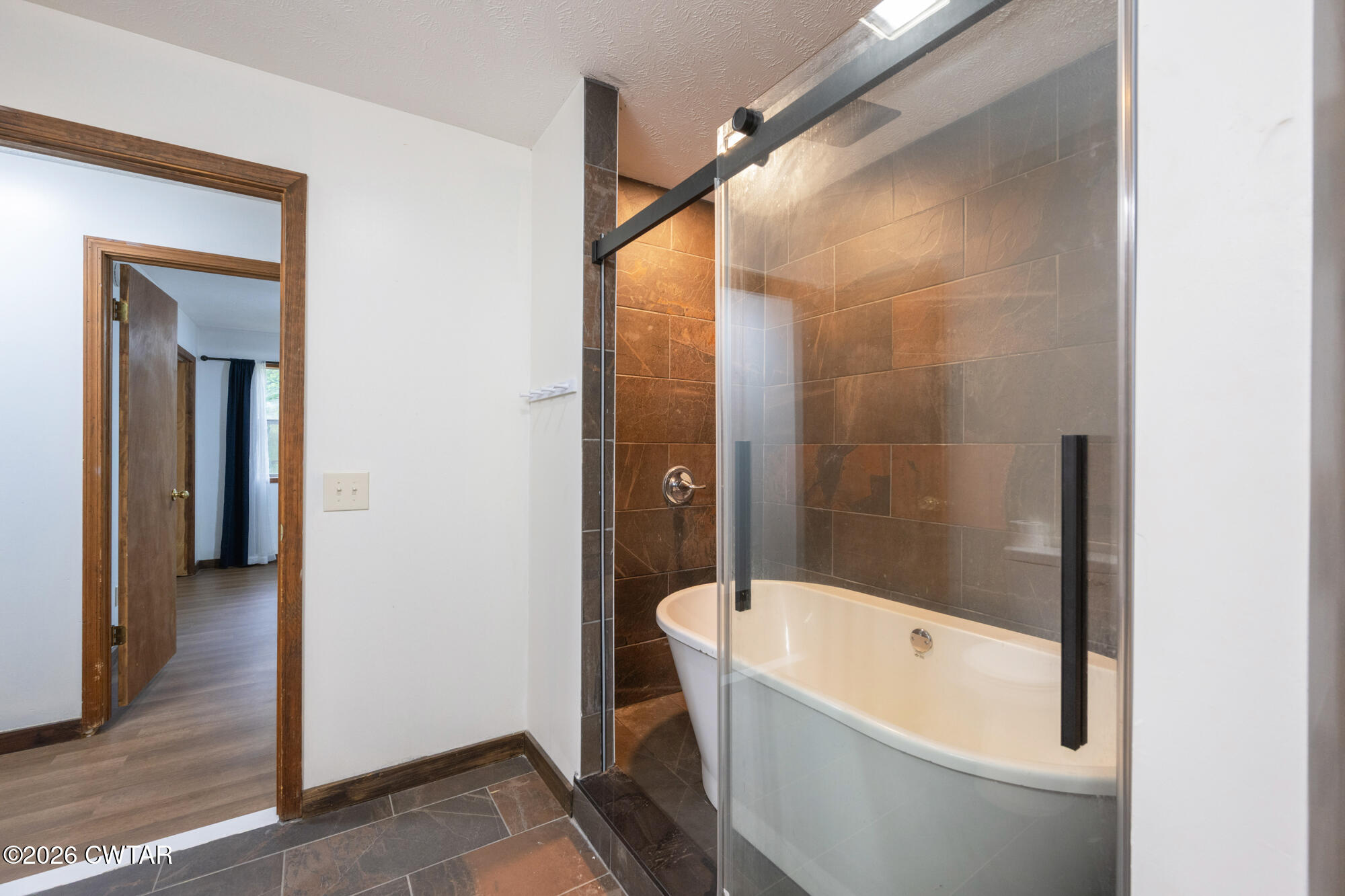 2827 Chapel Hill Road McKenzie, TN 38201 - Photo 22 of 40 a bathroom with a bathtub and a shower