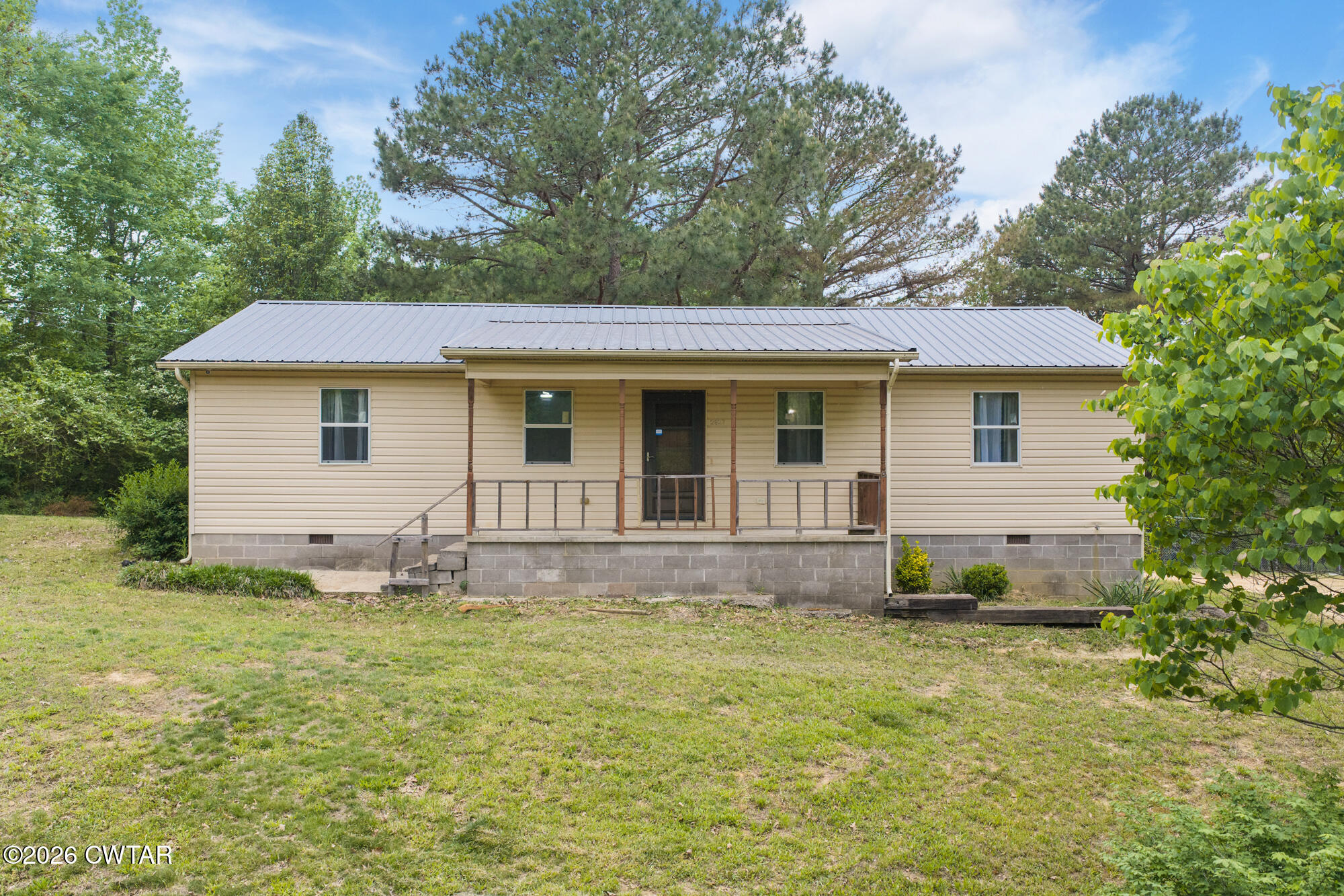 2827 Chapel Hill Road McKenzie, TN 38201 - Photo 36 of 40 a front view of a house with a yard
