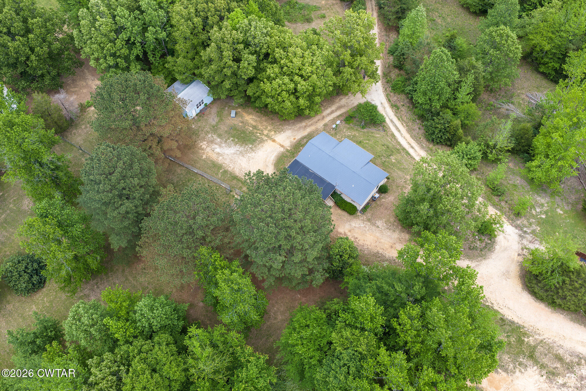 2827 Chapel Hill Road McKenzie, TN 38201 - Photo 4 of 40 an aerial view of a house with yard and outdoor seating