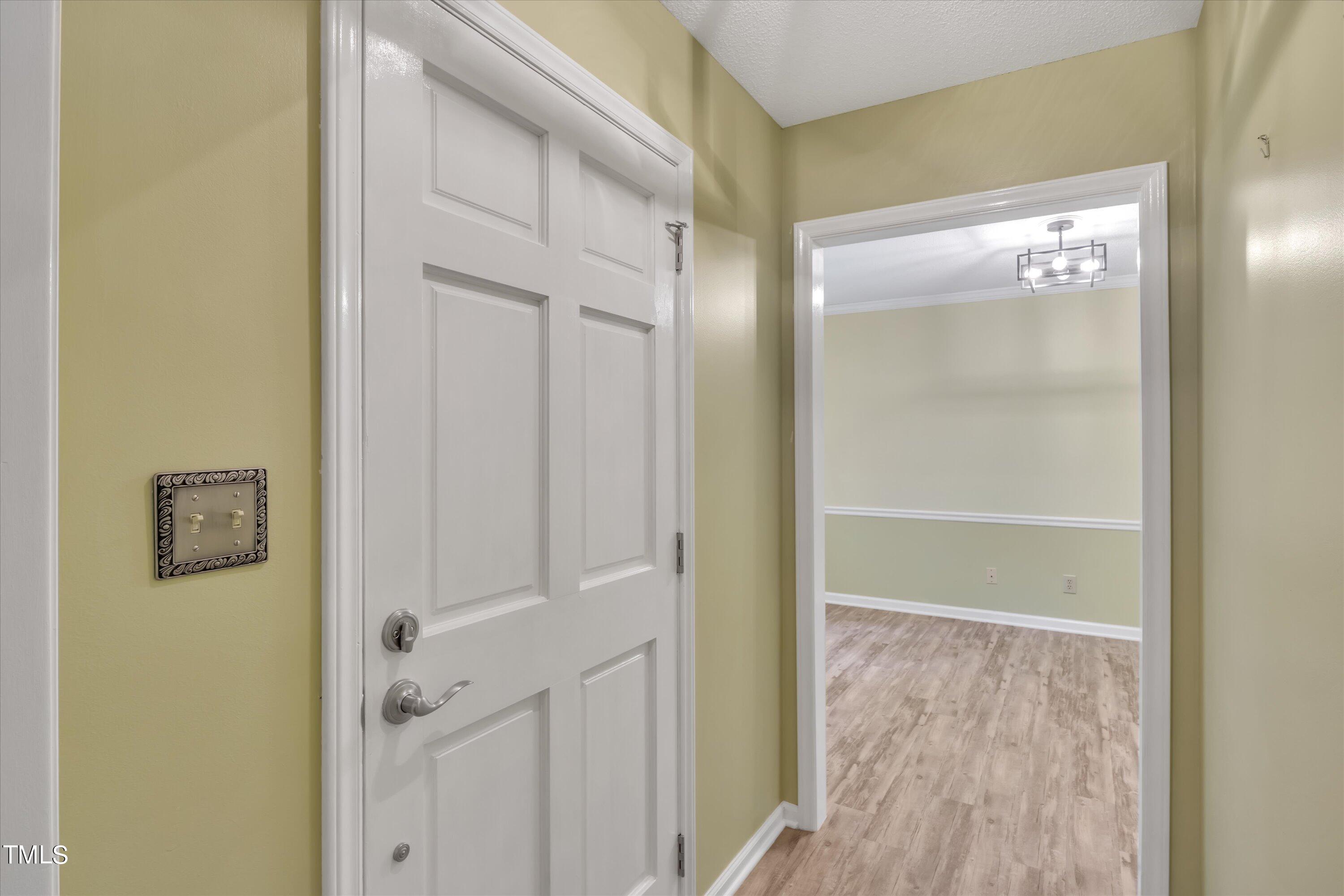 9208 Tree Meadow Lane Raleigh, NC 27603 - Photo 10 of 61 a view of a bathroom with a glass door