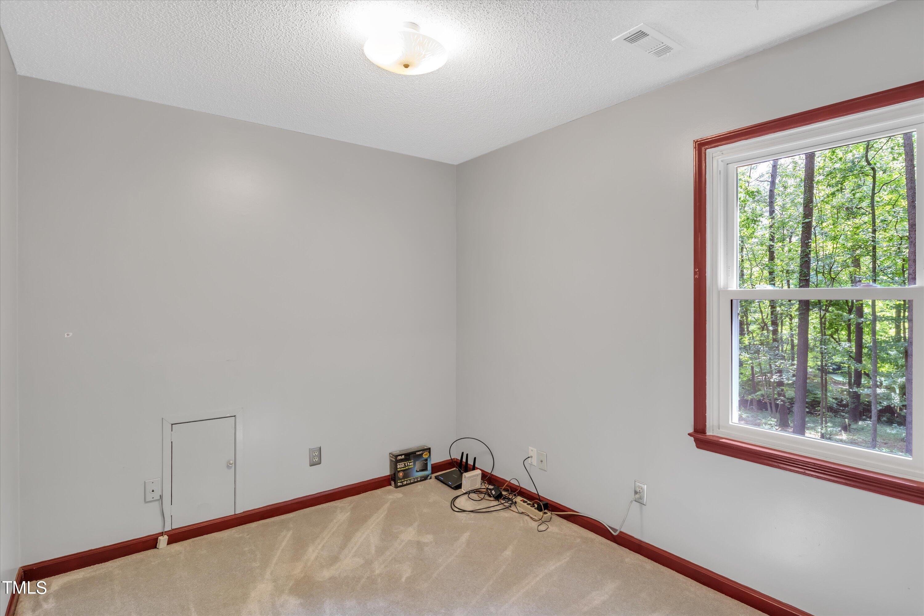 9208 Tree Meadow Lane Raleigh, NC 27603 - Photo 33 of 61 a room with a window