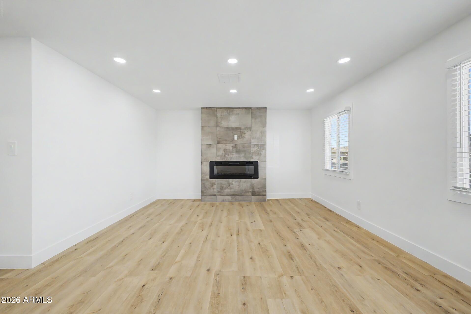5232 West Hearn Road Glendale, AZ 85306 - Photo 9 of 32 a view of empty room with wooden floor
