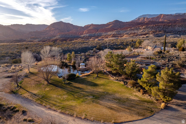 779 South Silver Road Leeds, UT 84746 - Photo 3 of 80 Aerial view of property's location featuring a mountain backdrop and rural landscape
