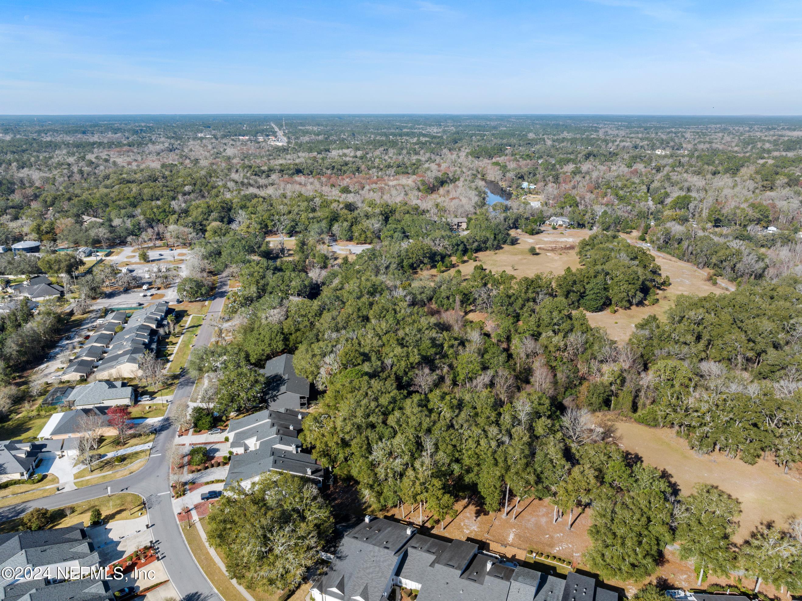3155 Ravines Road, Unit 3506 Middleburg, FL 32068 - Photo 19 of 20 an aerial view of a city with lots of residential buildings