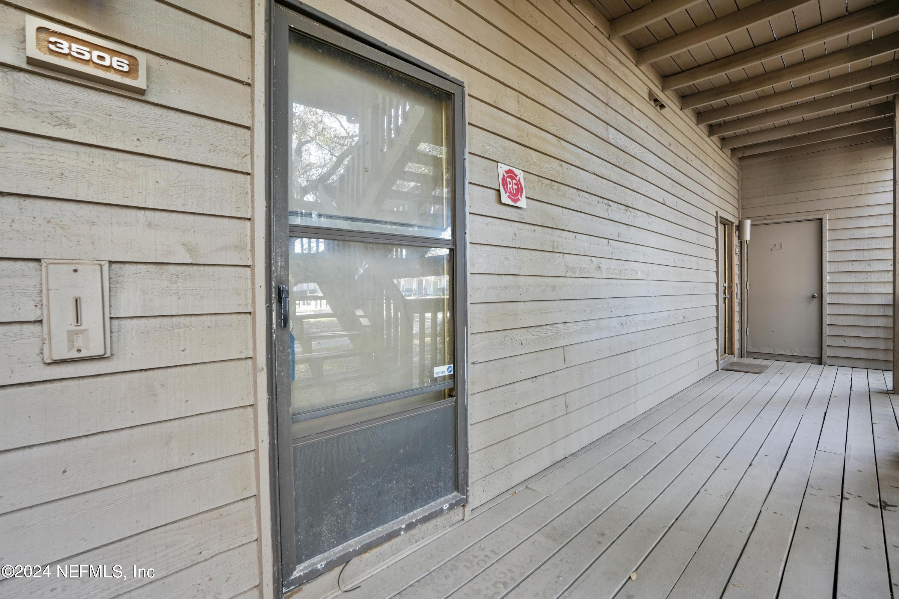 3155 Ravines Road, Unit 3506 Middleburg, FL 32068 - Photo 4 of 20 a view of wooden door