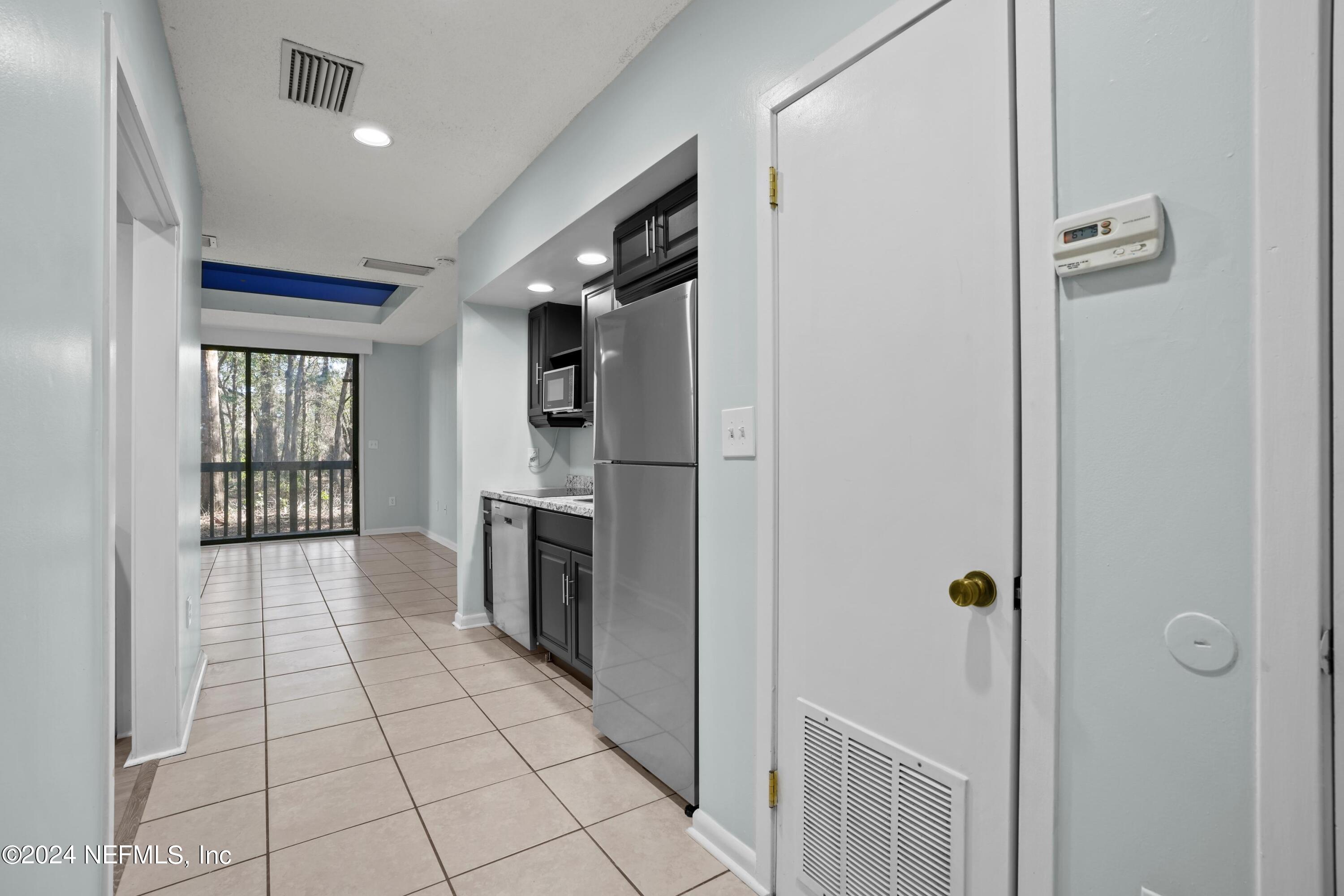 3155 Ravines Road, Unit 3506 Middleburg, FL 32068 - Photo 5 of 20 a view of a electric appliances and windows in a room