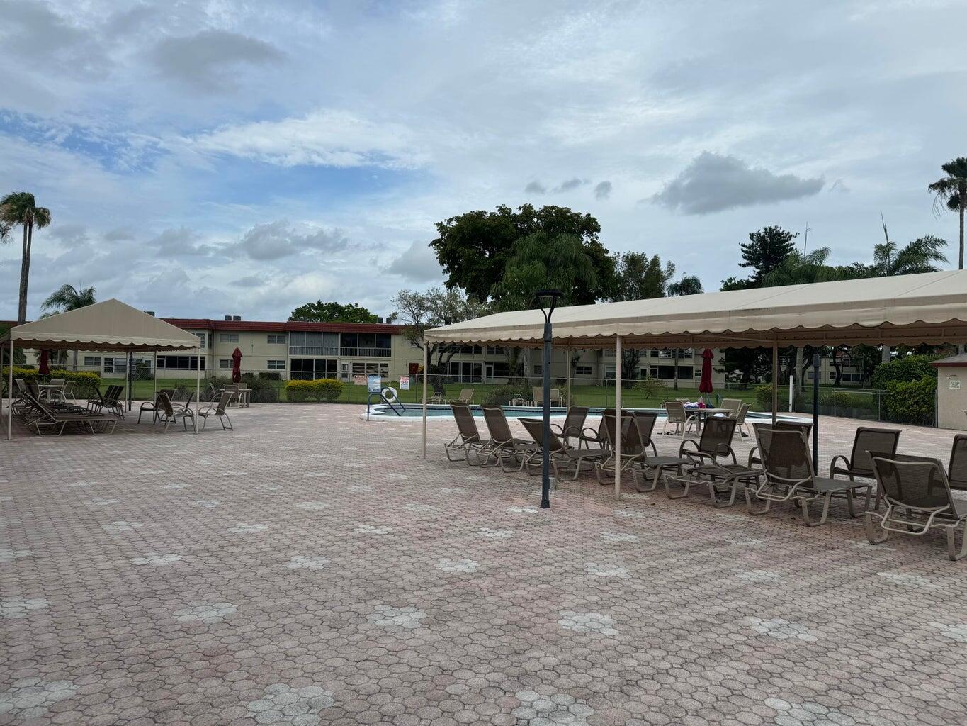 33 Abbey Lane, Unit 106 Delray Beach, FL 33446 - Photo 33 of 35 Abbey pool