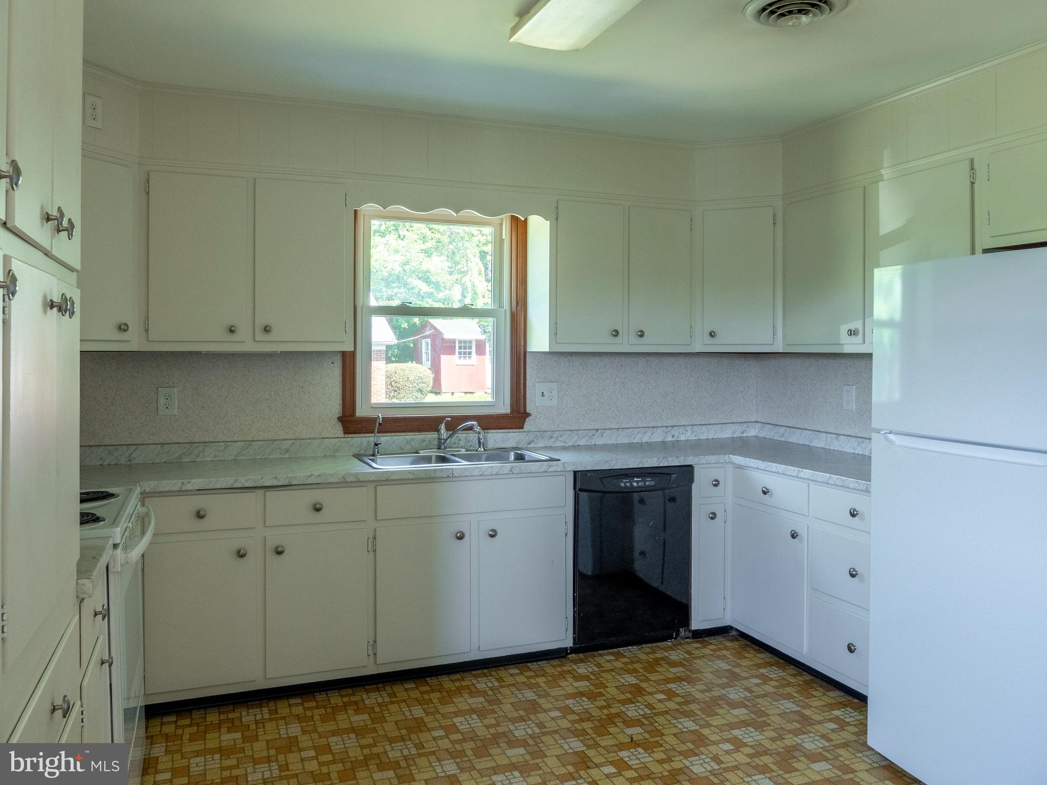26906 Clarksburg Road Damascus, MD 20872 - Photo 8 of 17 a kitchen with granite countertop white cabinets and a stove