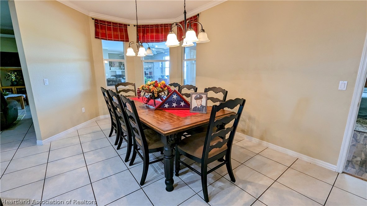 2120 Jack Smith Road Zolfo Springs, FL 33890 - Photo 12 of 36 a view of a dining room with furniture and chandelier