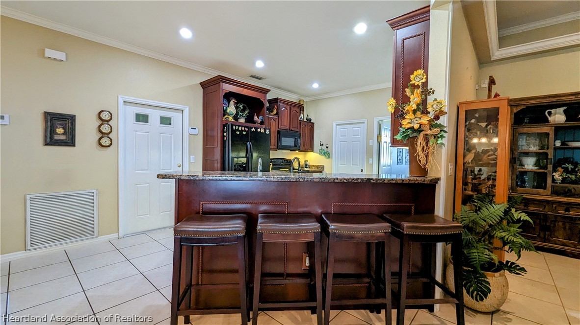 2120 Jack Smith Road Zolfo Springs, FL 33890 - Photo 13 of 36 a view of a dining room with furniture