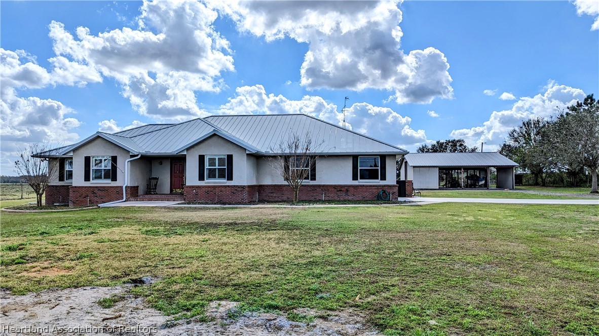 2120 Jack Smith Road Zolfo Springs, FL 33890 - Photo 2 of 36 a view of a yard in front of the house
