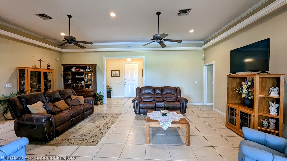 2120 Jack Smith Road Zolfo Springs, FL 33890 - Photo 22 of 36 a living room with furniture and a flat screen tv