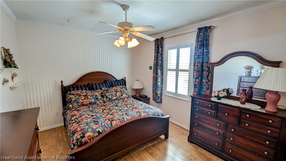 2120 Jack Smith Road Zolfo Springs, FL 33890 - Photo 25 of 36 a bedroom with a bed and a dresser