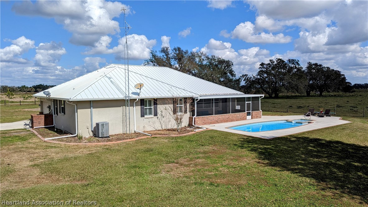 2120 Jack Smith Road Zolfo Springs, FL 33890 - Photo 26 of 36 a view of a house with backyard and sitting area