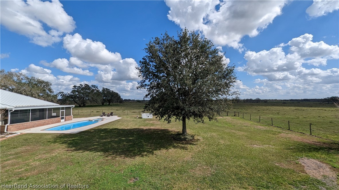 2120 Jack Smith Road Zolfo Springs, FL 33890 - Photo 27 of 36 a view of a swimming pool with a yard