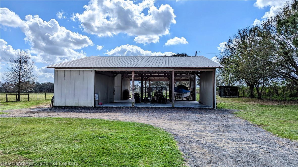 2120 Jack Smith Road Zolfo Springs, FL 33890 - Photo 28 of 36 a front view of a house with garden