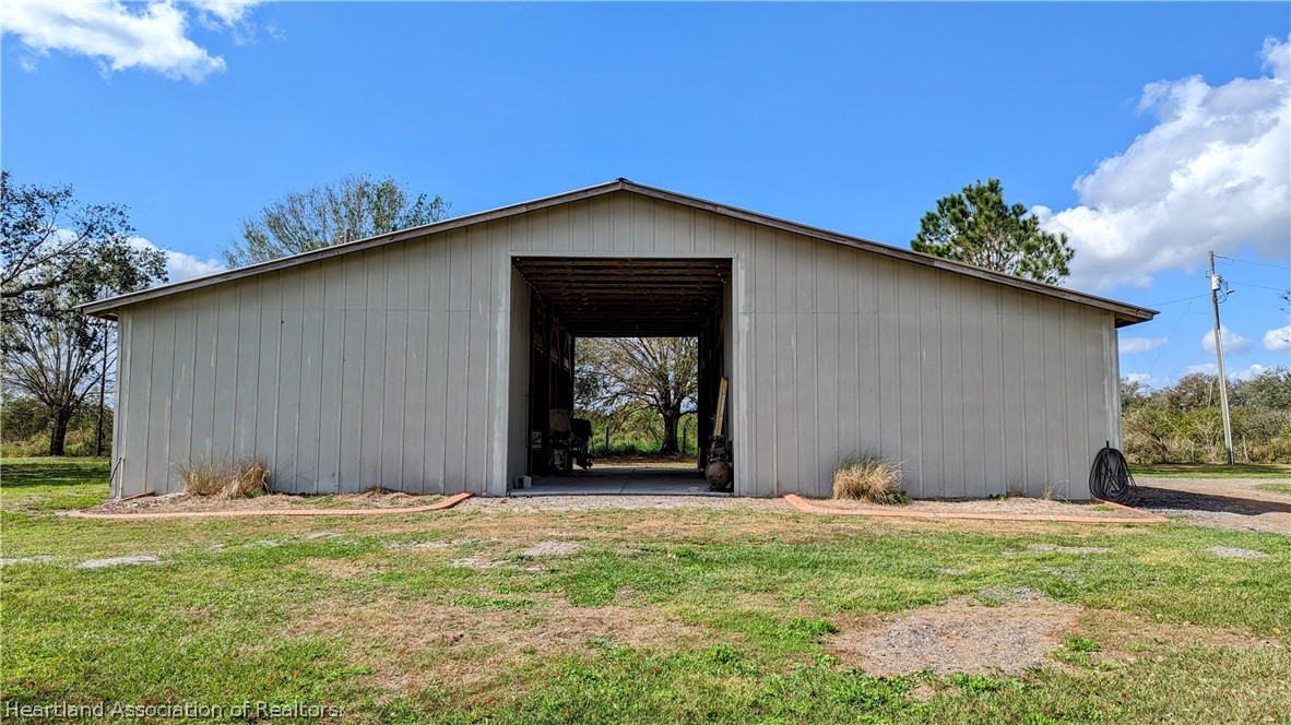 2120 Jack Smith Road Zolfo Springs, FL 33890 - Photo 32 of 36 a front view of a house with garden
