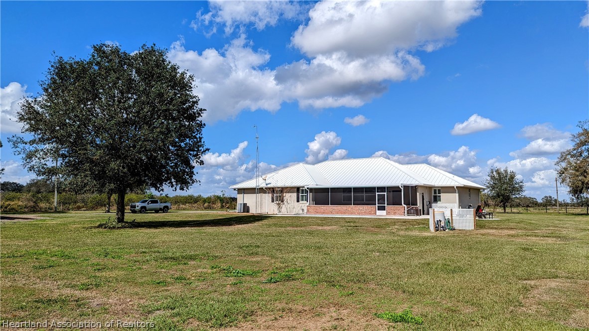 2120 Jack Smith Road Zolfo Springs, FL 33890 - Photo 33 of 36 a front view of a building with garden