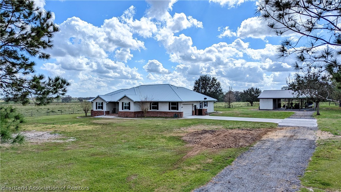 2120 Jack Smith Road Zolfo Springs, FL 33890 - Photo 4 of 36 a view of a house with a yard