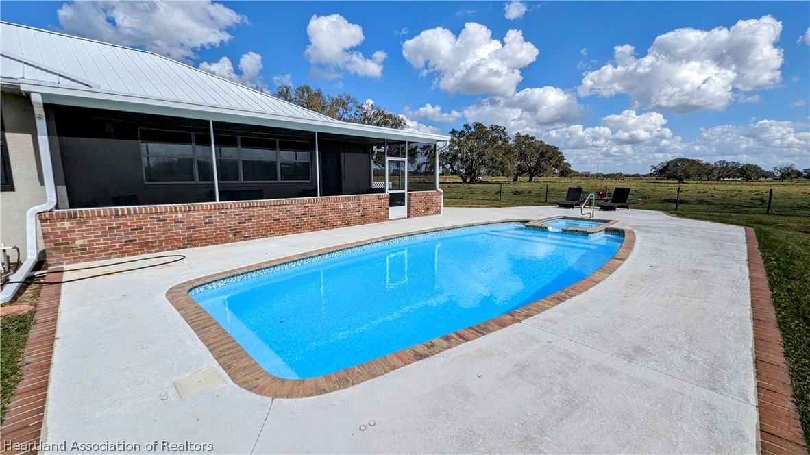 2120 Jack Smith Road Zolfo Springs, FL 33890 - Photo 5 of 36 a view of swimming pool with outdoor seating