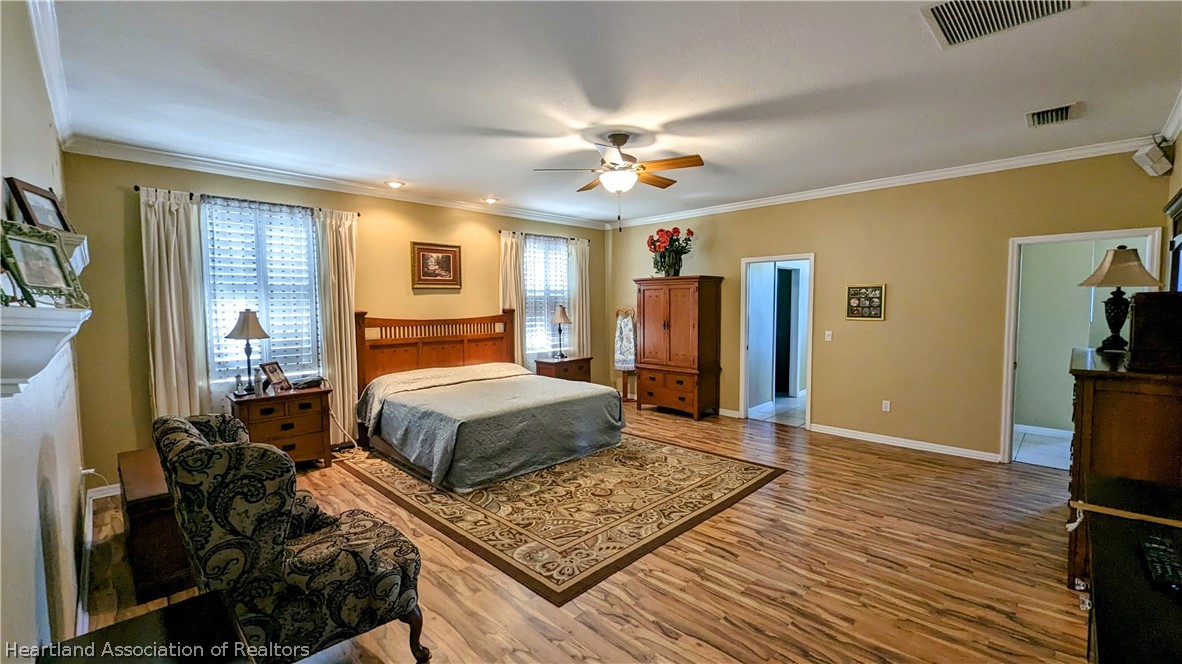 2120 Jack Smith Road Zolfo Springs, FL 33890 - Photo 6 of 36 a bedroom with a bed and wooden floor