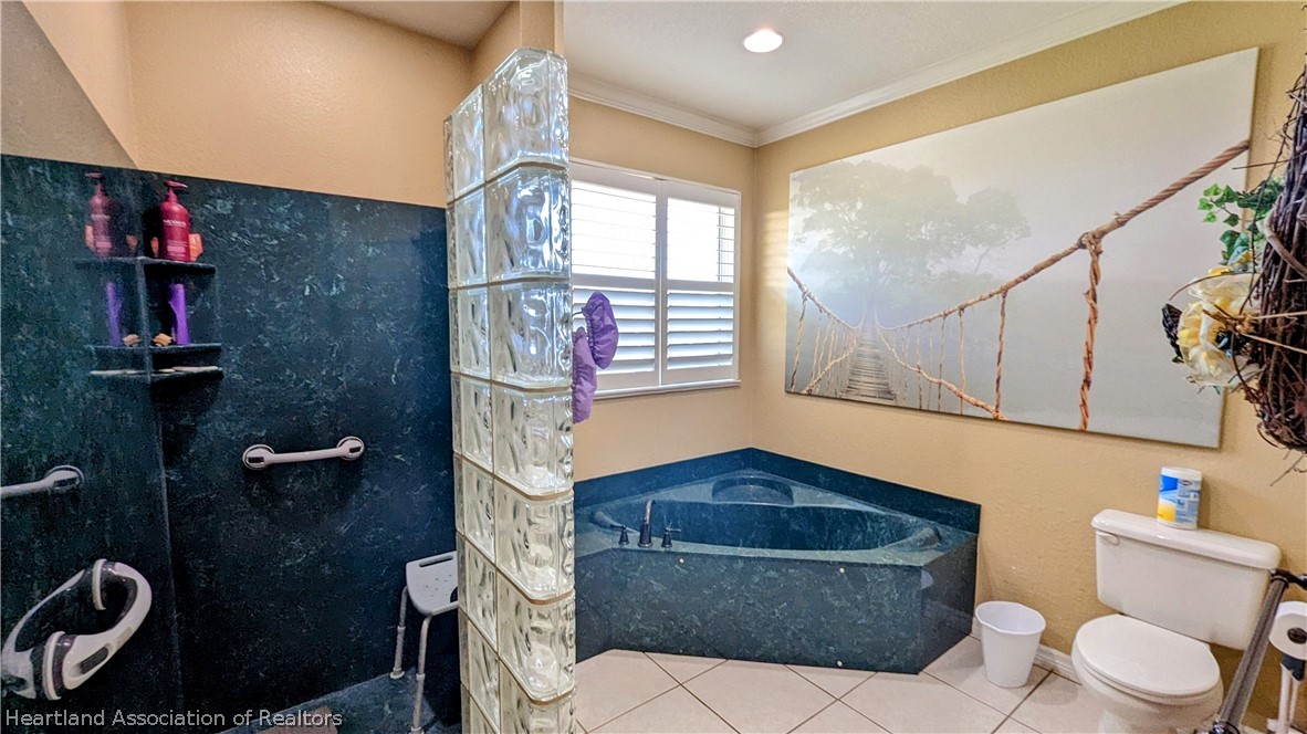 2120 Jack Smith Road Zolfo Springs, FL 33890 - Photo 7 of 36 a bathroom with a toilet a sink and mirror