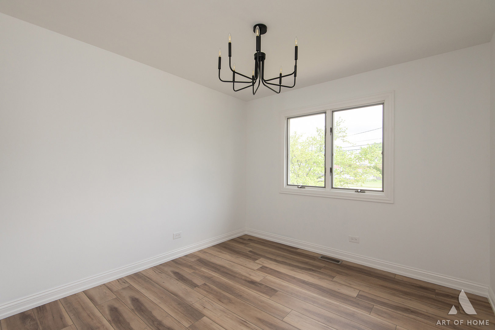 1170 McCarthy Road Lemont, IL 60439 - Photo 25 of 53 an empty room with wooden floor ceiling fan and windows