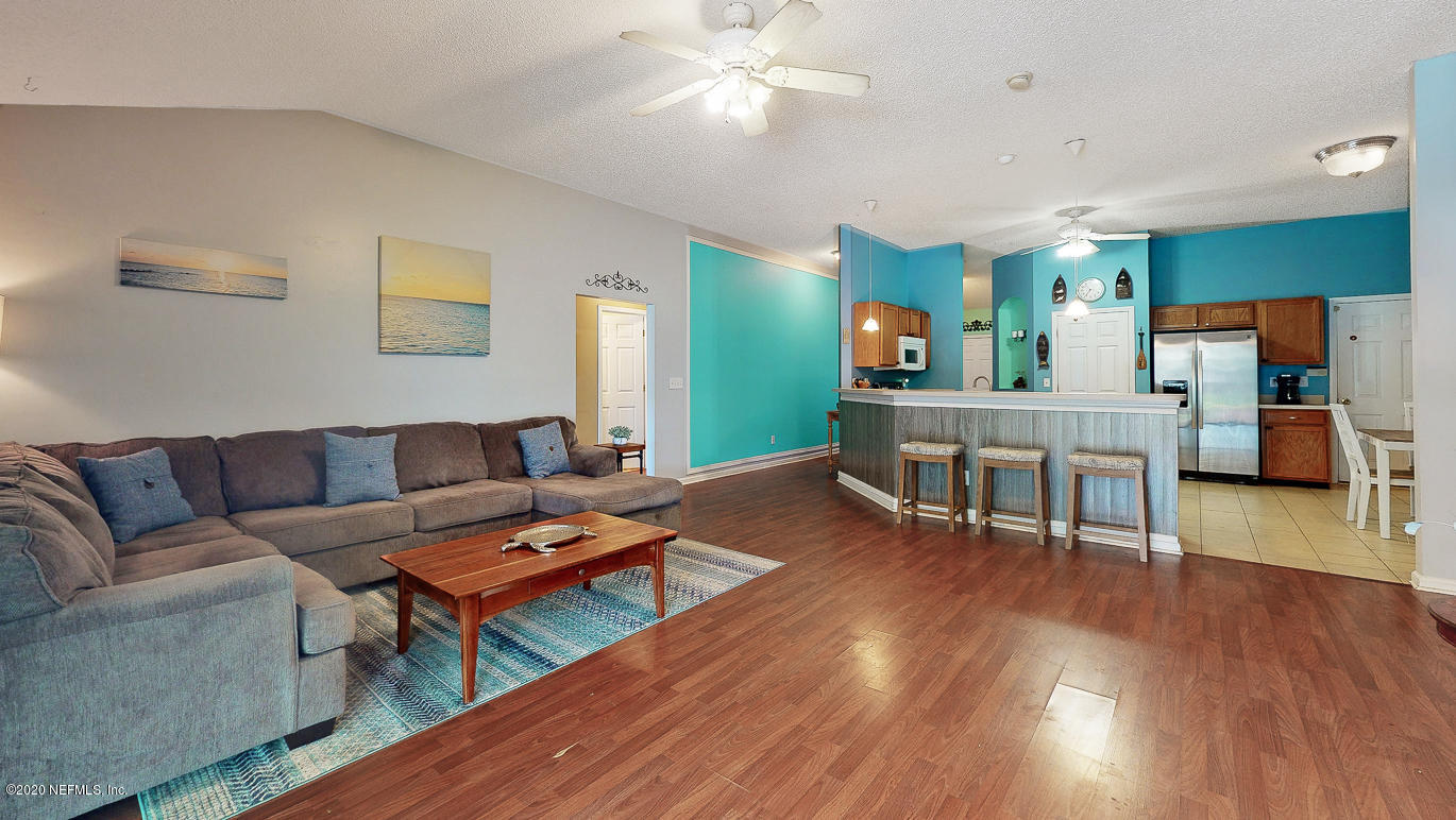 8232 Leafcrest Drive Jacksonville, FL 32244 - Photo 13 of 33 a living room with furniture and a wooden floor