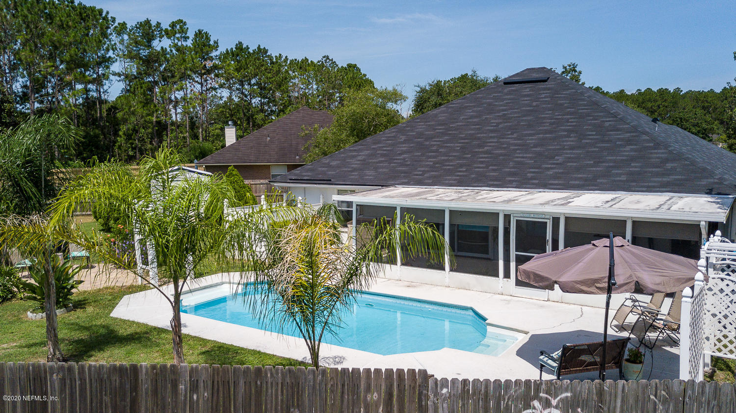 8232 Leafcrest Drive Jacksonville, FL 32244 - Photo 25 of 33 a view of a house with backyard and sitting area