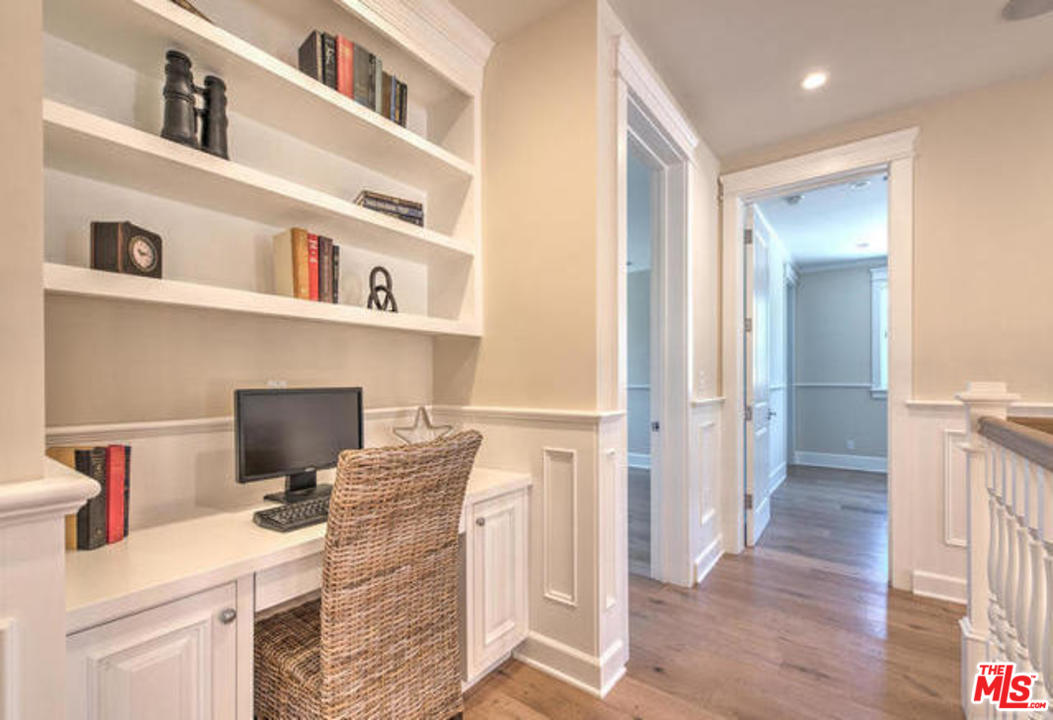 17841 Palora Street Encino, CA 91316 - Photo 14 of 33 a workspace with furniture and wooden floor